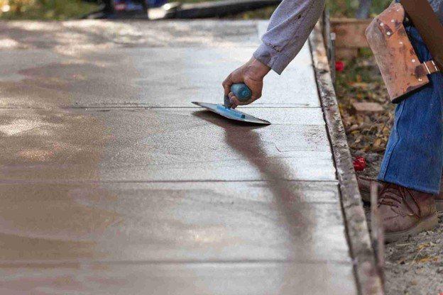 Newly installed concrete driveway with smooth finish and clean layout at residential home in North Ridgeville, OH